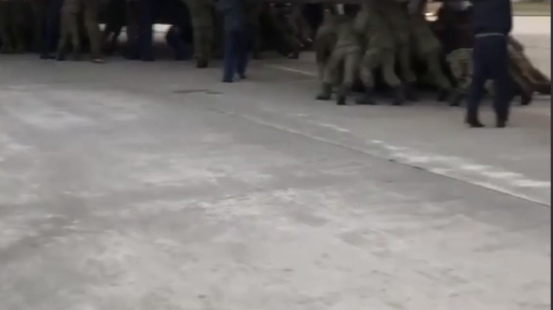 Only in Russia: Russian soldiers attempting to push start IL-76 plane
